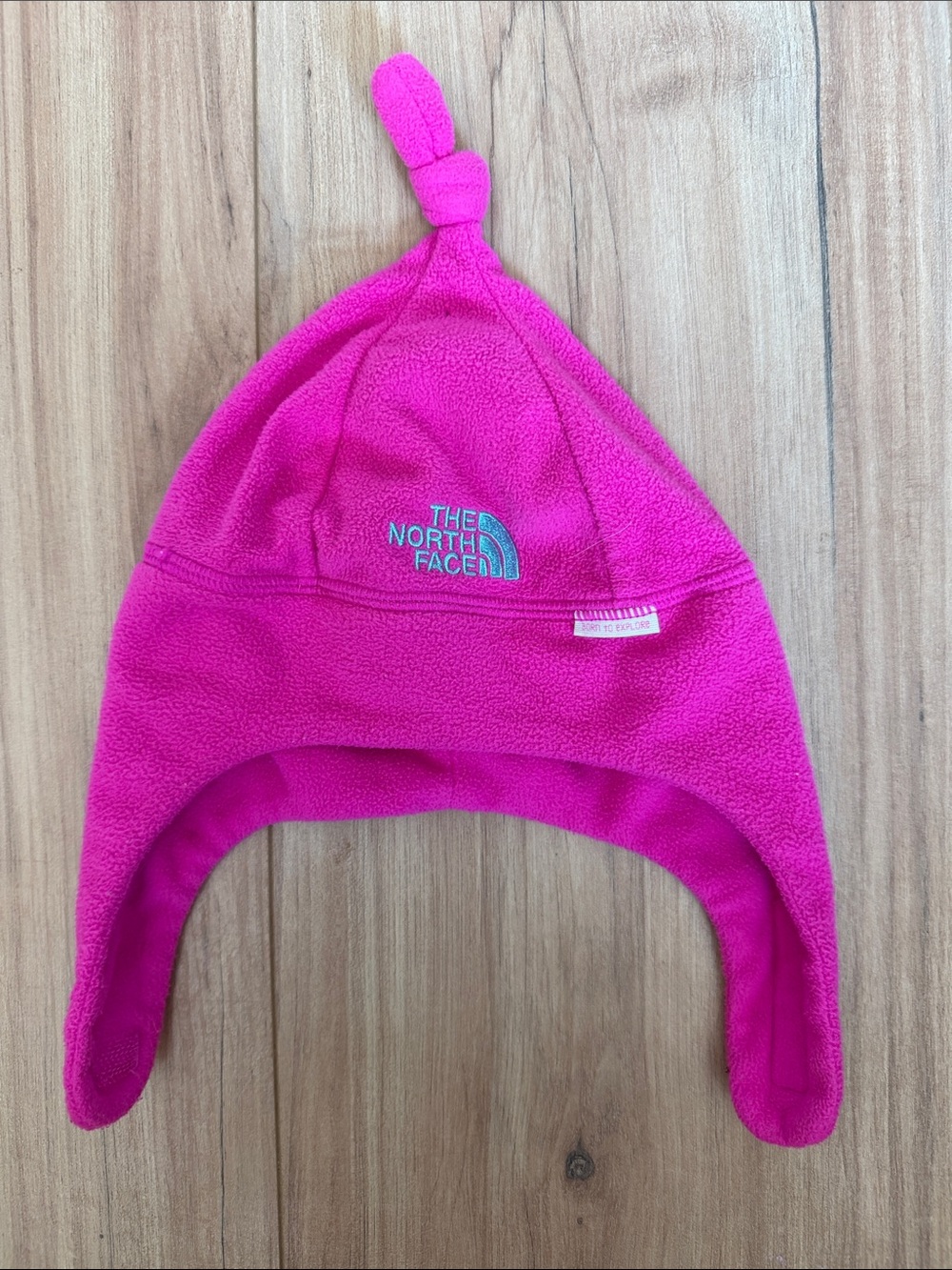 The North Face Kids Bright Pink Fleece Earflap Hat with Top Knot